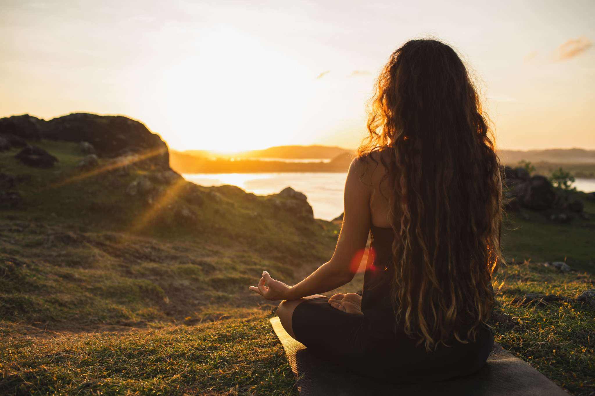 woman meditation sunset