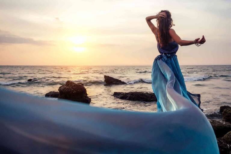 beautiful woman by the beach luxury elegant view